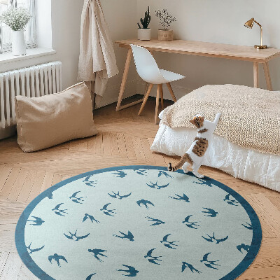 Kulatý vinylový koberec Malé lístky na modrém pozadí