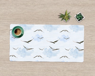 Ochranná podložka na stůl Ptáci na modré obloze