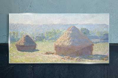 Obraz na skle Letní slunce nad kupkami sena