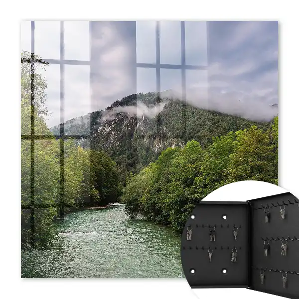 Horská krajina s řekou a lesem
