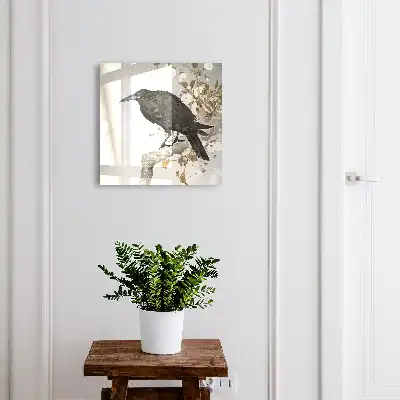 Černý havran na větvi s květinami